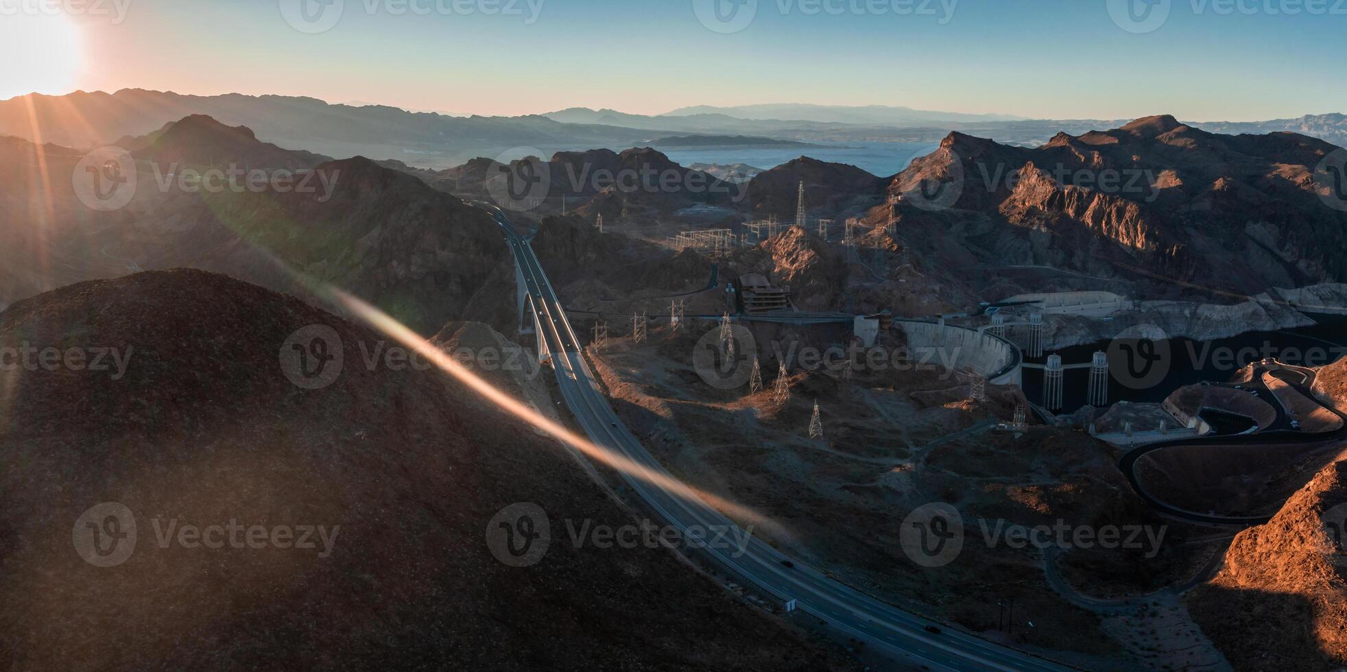 Hoover Dam on the Colorado River straddling Nevada and Arizona at dawn from above. photo