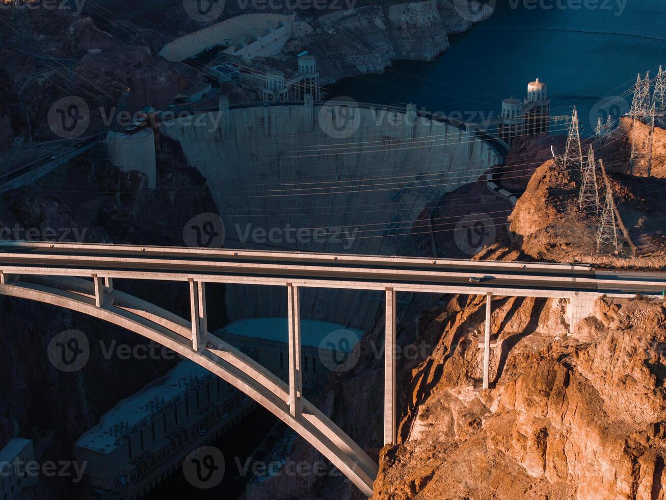 Hoover Dam on the Colorado River straddling Nevada and Arizona at dawn from above. photo