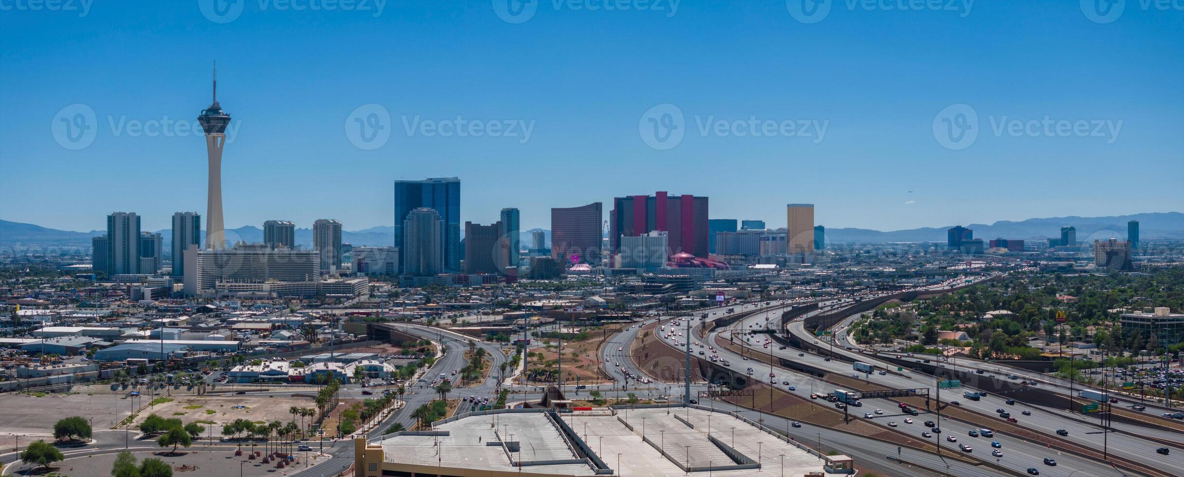 Aerial View of Las Vegas Skyline with Stratosphere Tower and Famous Hotels on Sunny Day photo