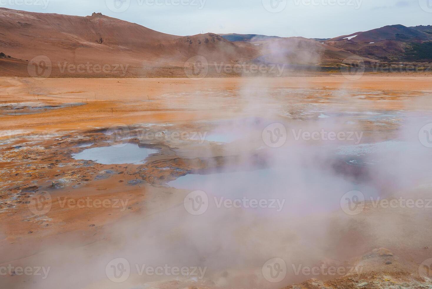 Steaming Hot Springs and Bubbling Mud Pools in Iceland's Geothermal Area photo