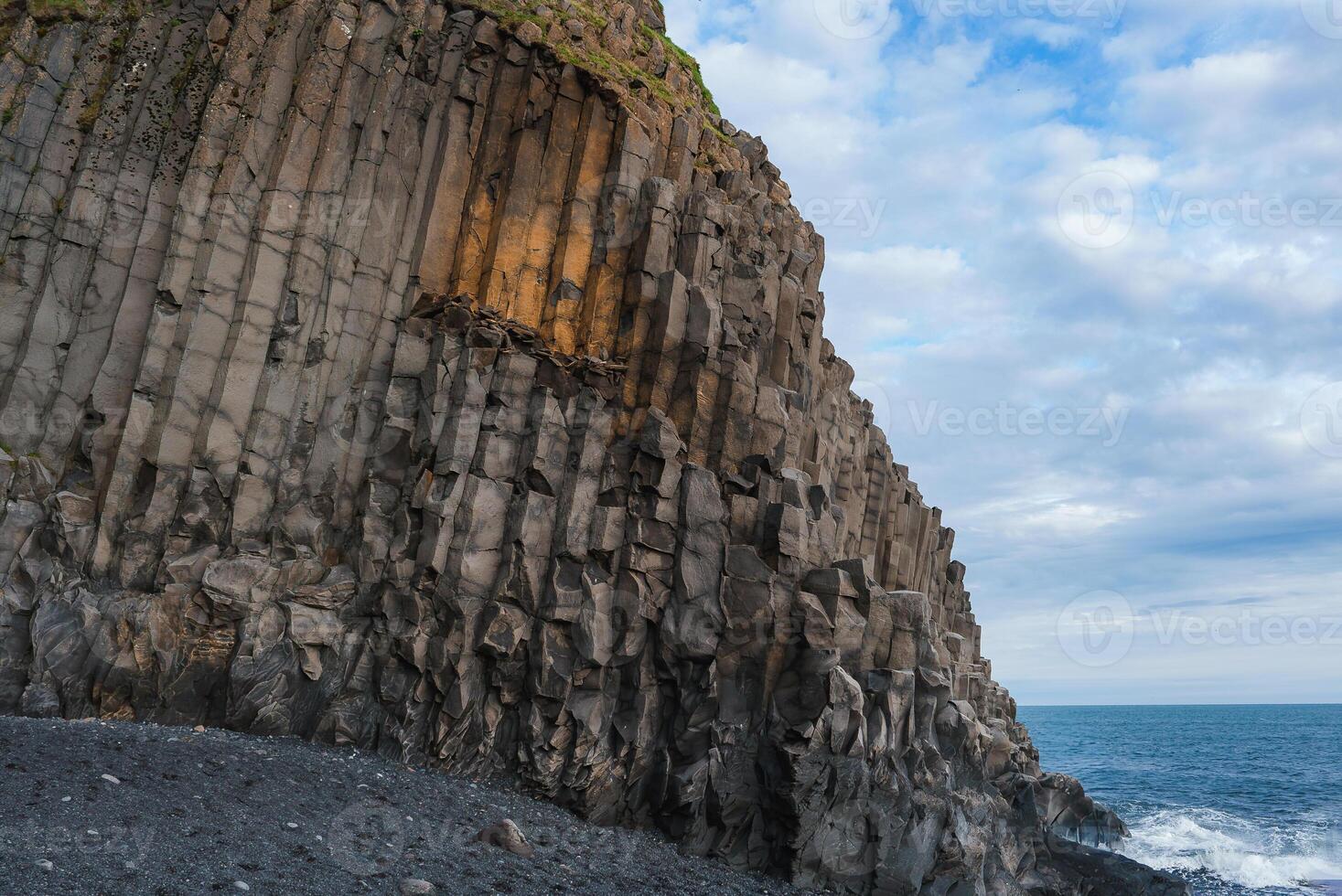 Striking Basalt Columns of Reynisfjara Beach with North Atlantic Ocean photo