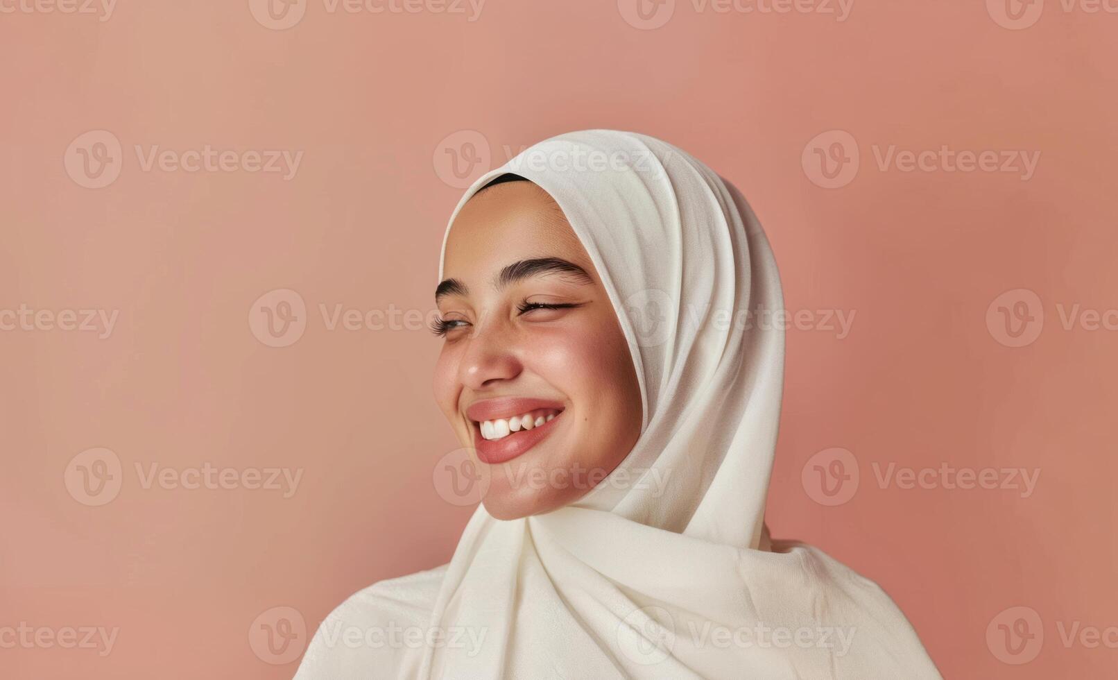 Smiling Young Woman in Hijab with Soft Pink Background.Generated image photo