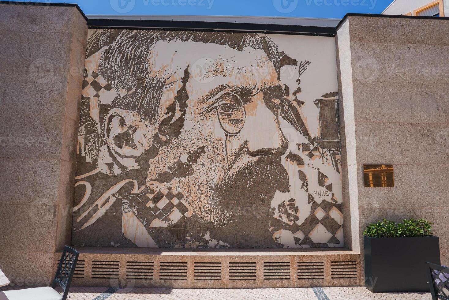 Intricate Mural of Man with Monocle on Stone Wall in Luxury Hotel Exterior photo