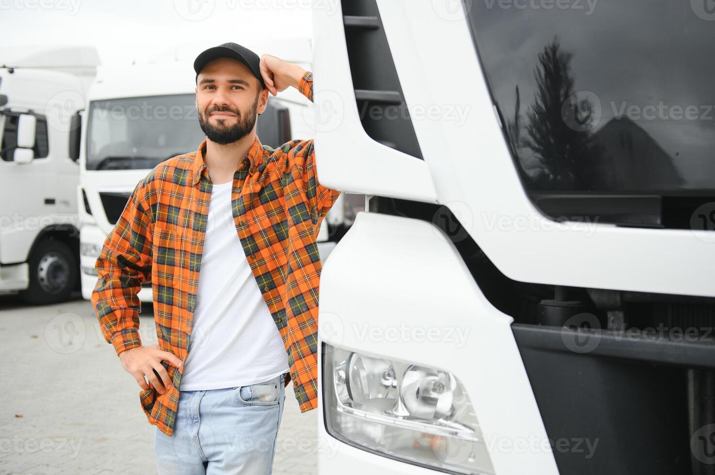 Portrait of confident truck driver on parking lot. Copy space photo