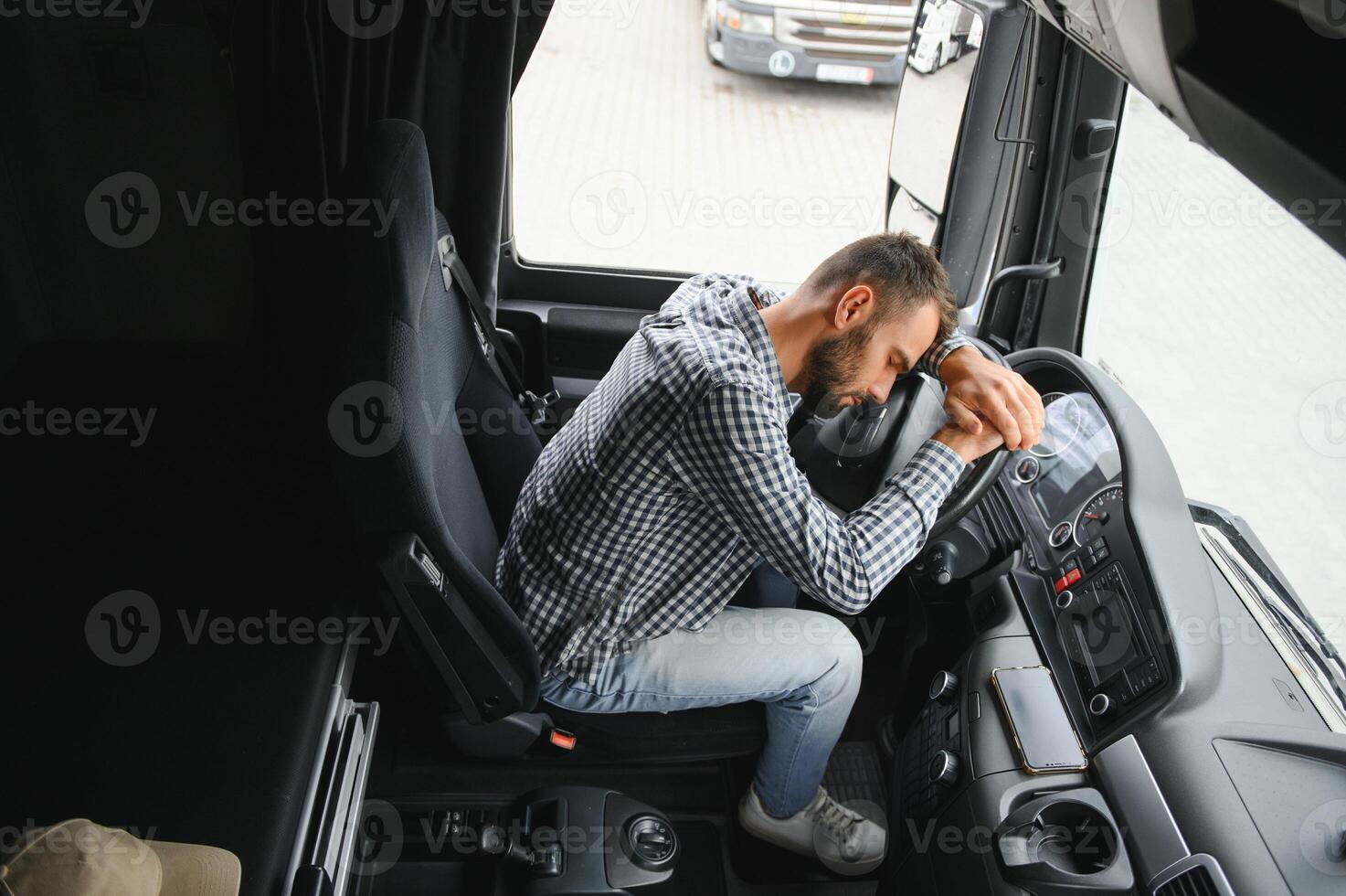 Portrait of tired truck driver feeling sleepy and sick. photo