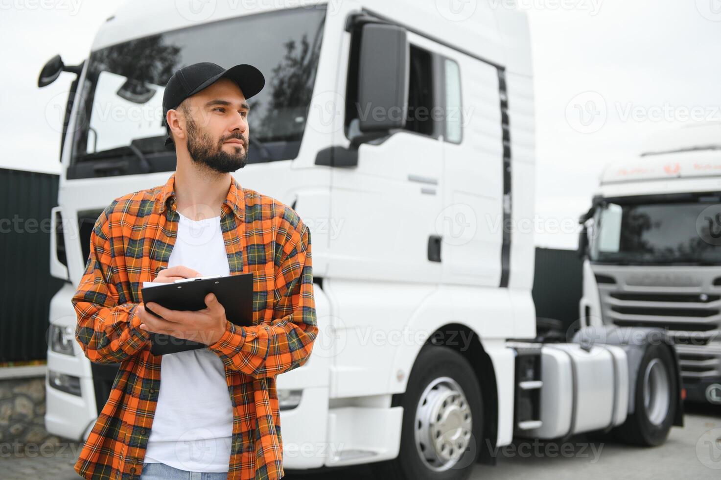 Men driver near lorry truck. Man owner truck driver near truck. Man trucker trucking owner. Transportation industry vehicles. Handsome man driver front of truck. photo