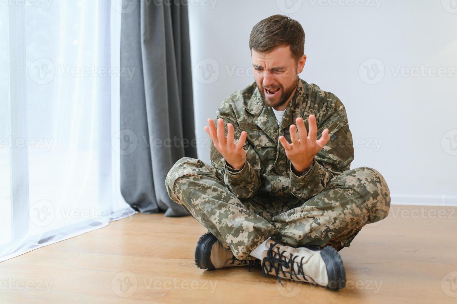 Military veteran with post traumatic stress disorder screaming at home photo