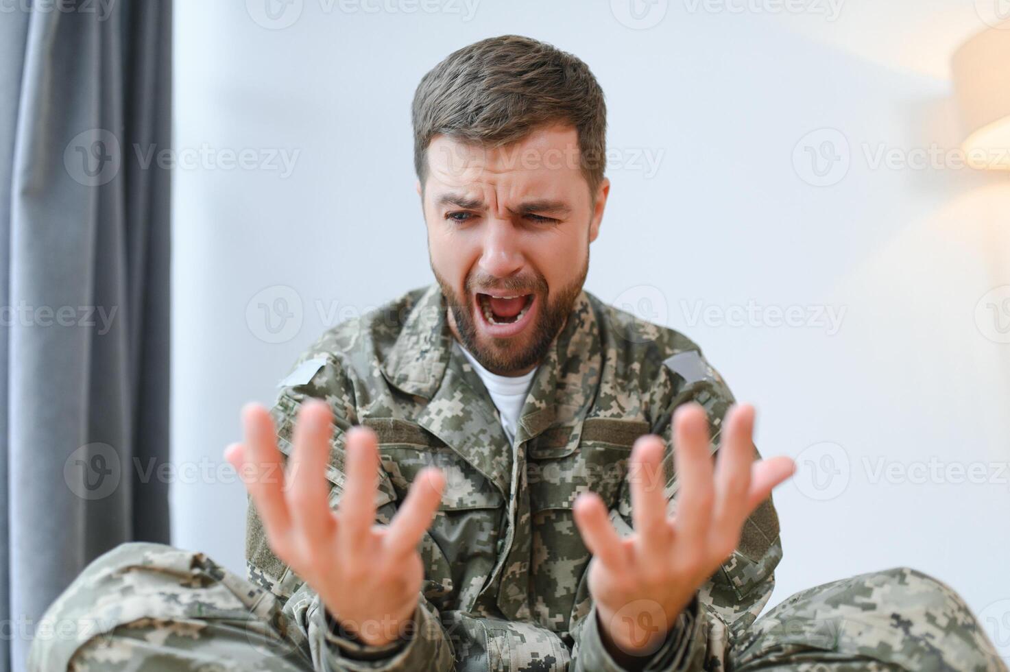 Military veteran with post traumatic stress disorder screaming at home photo