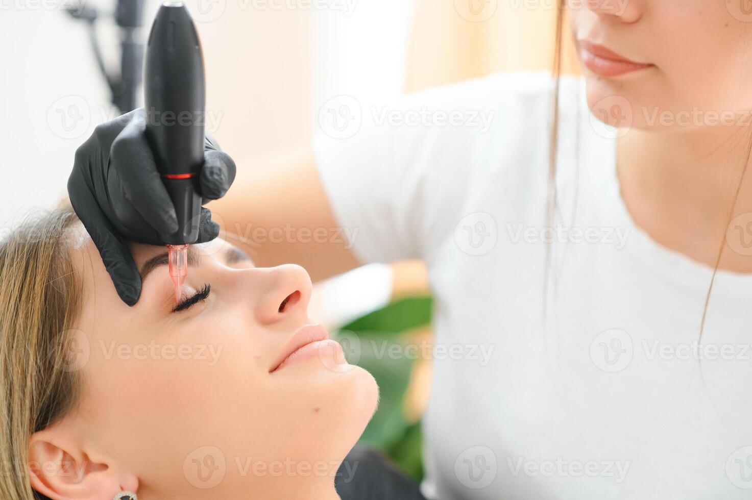 Eyebrows tattoo or Permanent Makeup. Beauty eyebrow upgrade procedure. photo