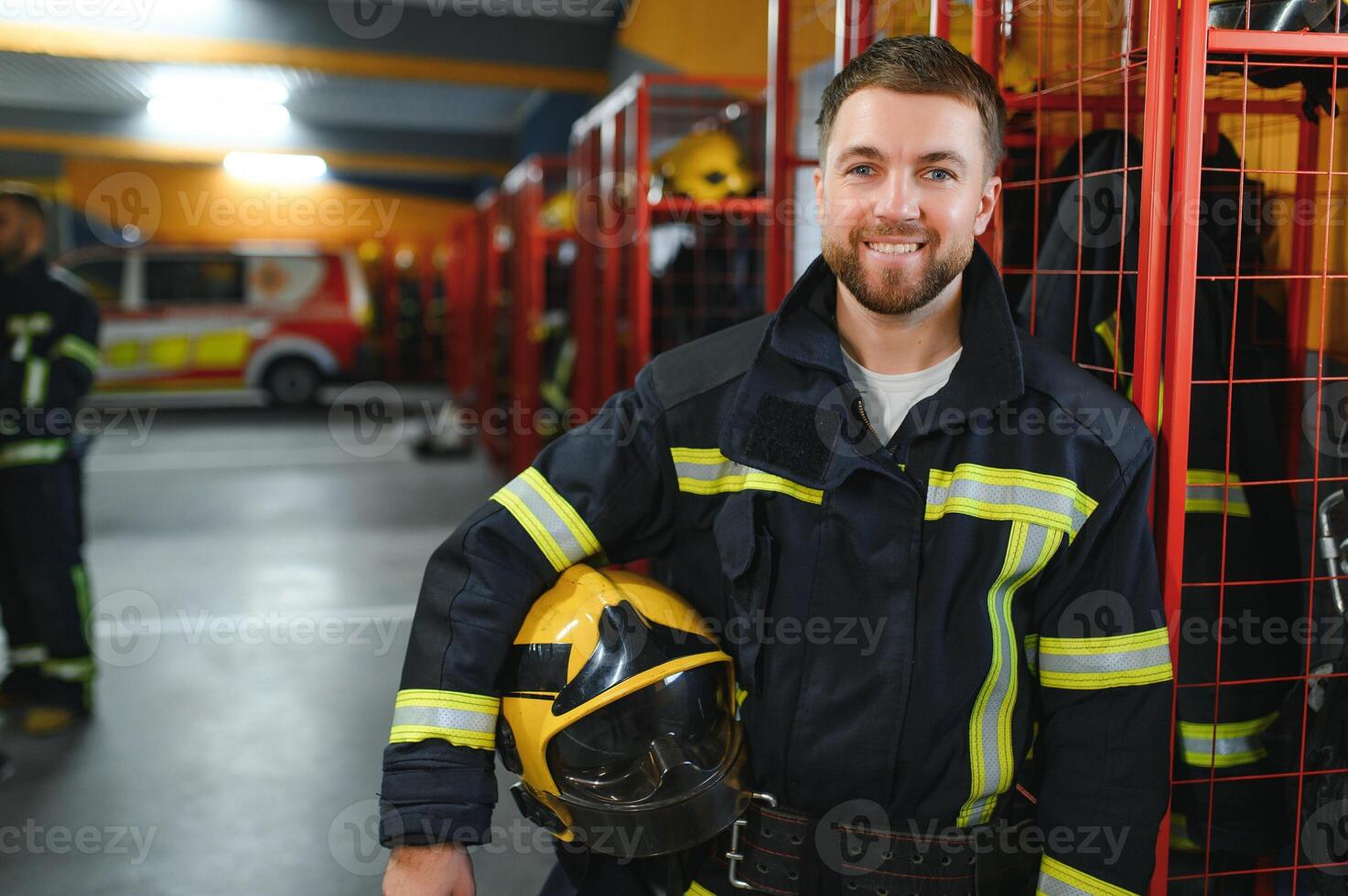 Young handsome fireman in the fire department photo