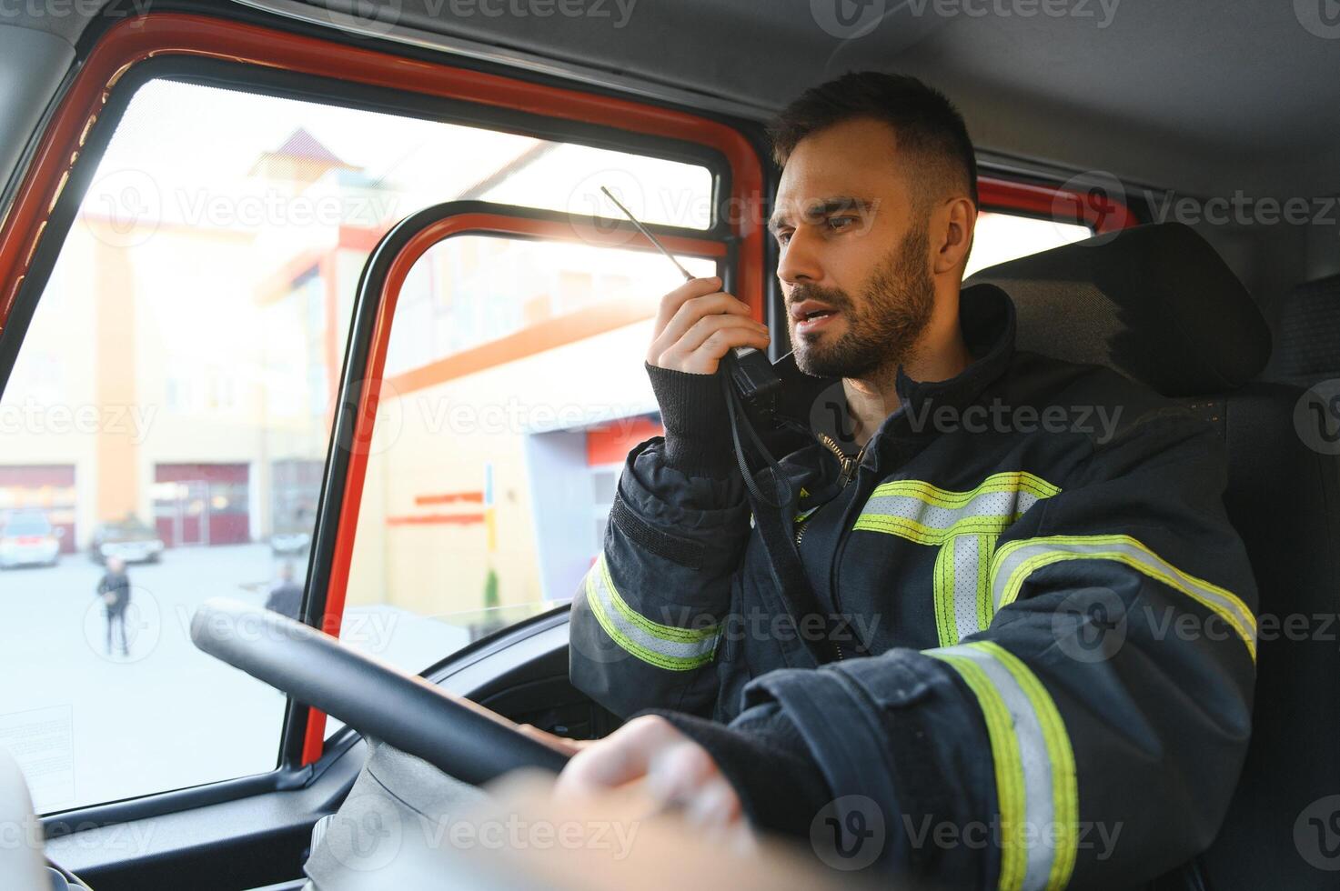 Driver of a fire truck in action photo