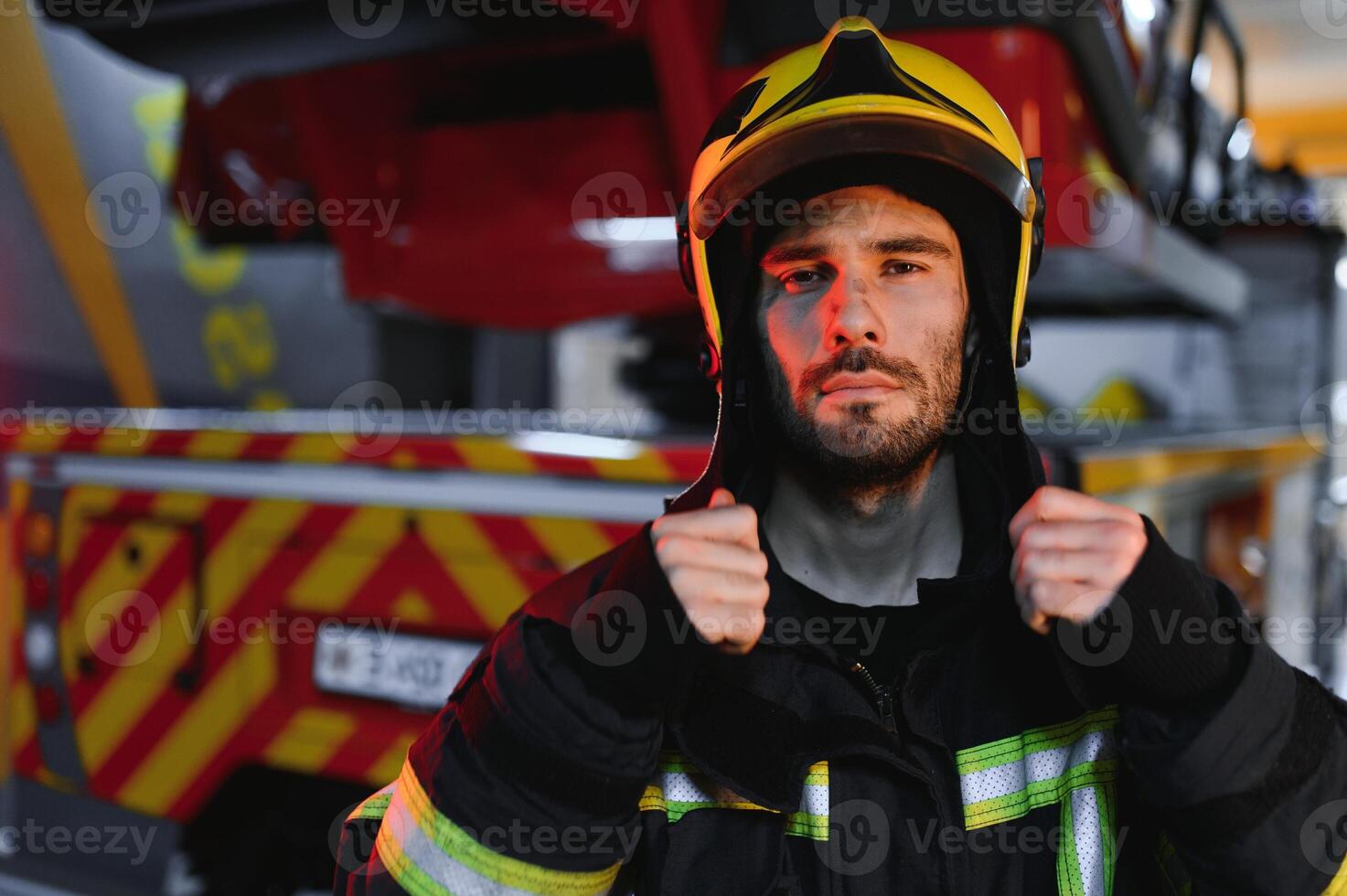 tired firefighter after work in a fire department photo