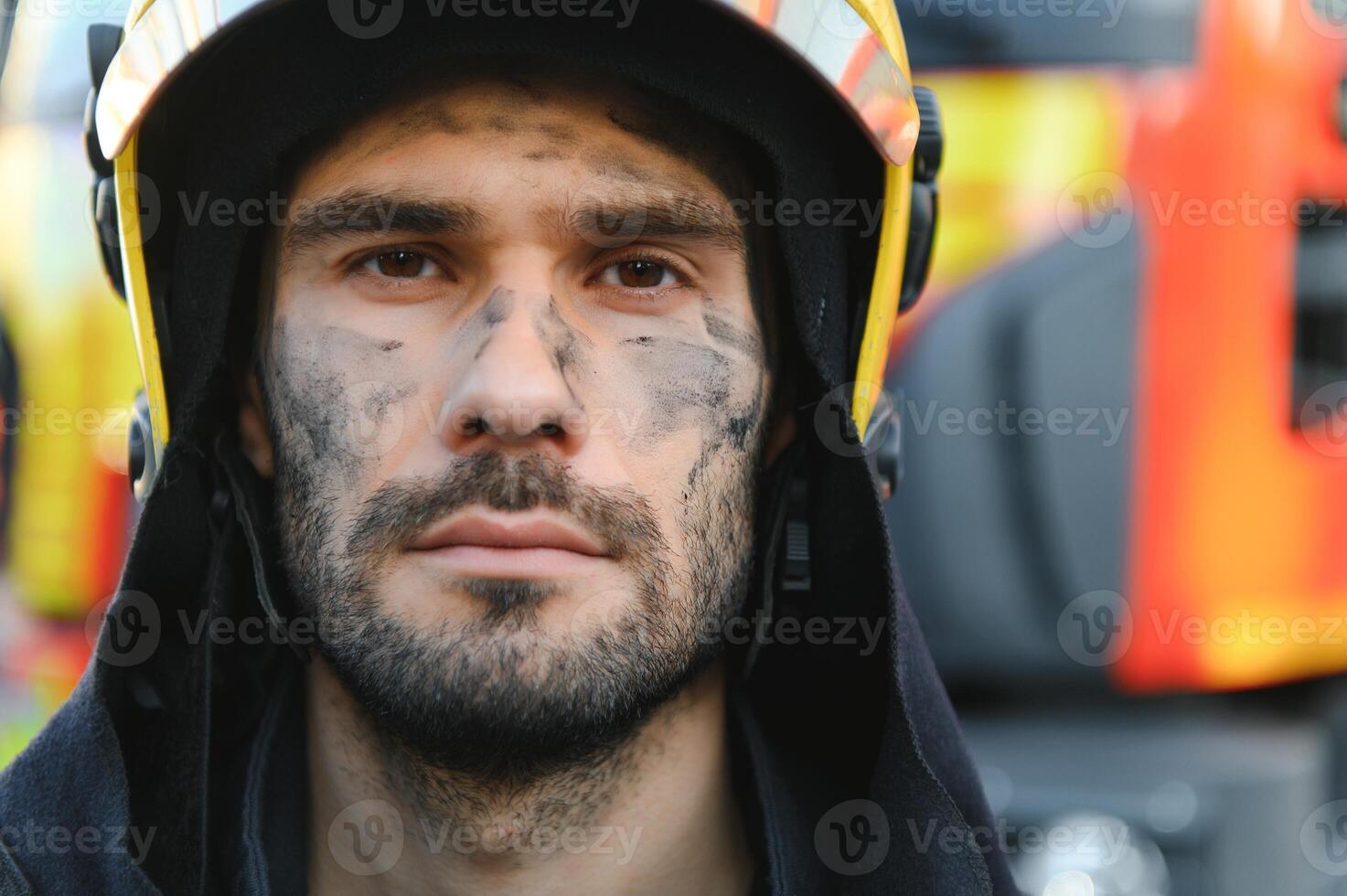 tired firefighter after work in a fire department photo