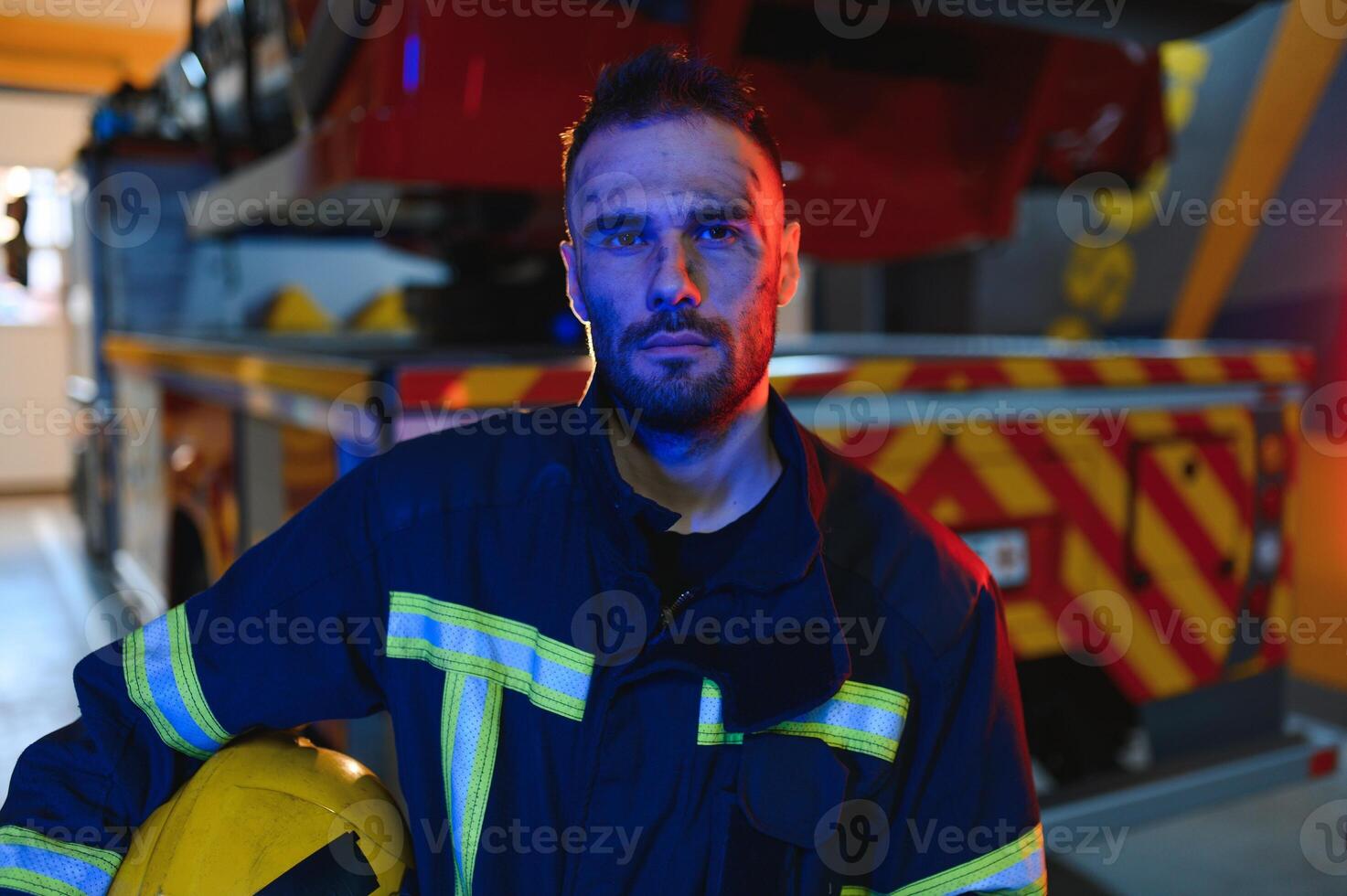 tired firefighter after work in a fire department photo