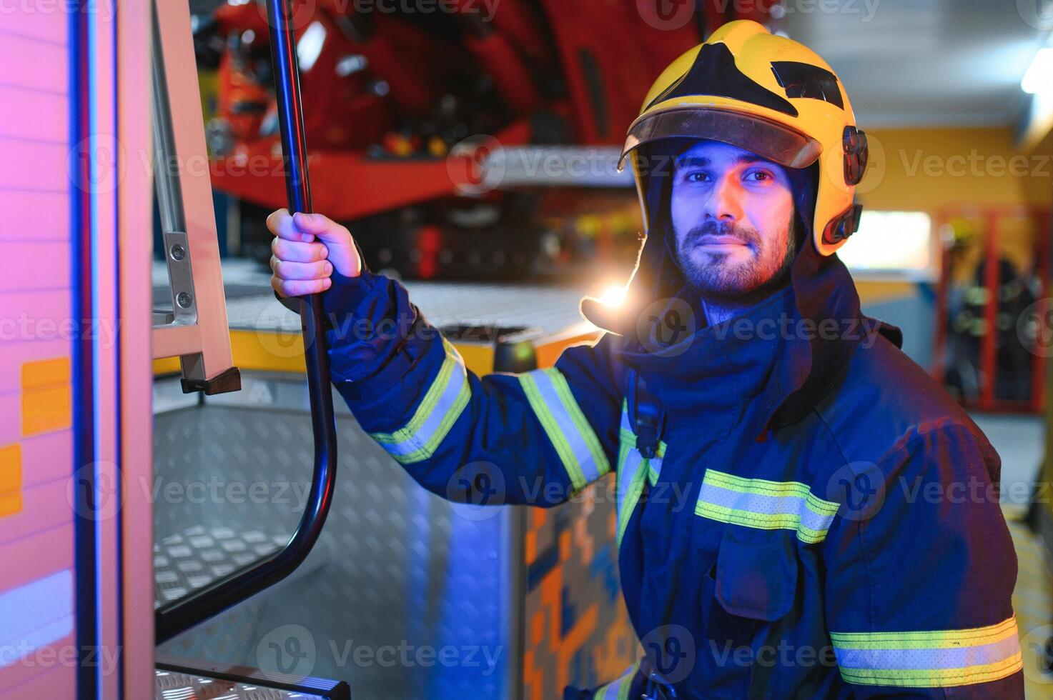 Photo of fireman with gas mask and helmet near fire engine