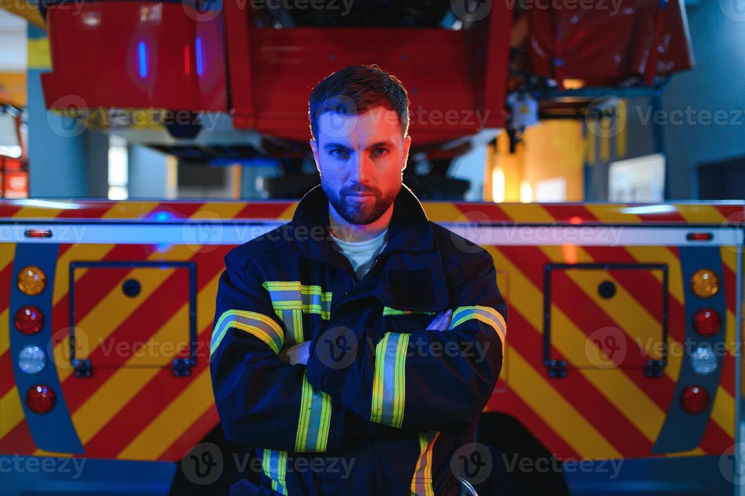 Photo of fireman with gas mask and helmet near fire engine
