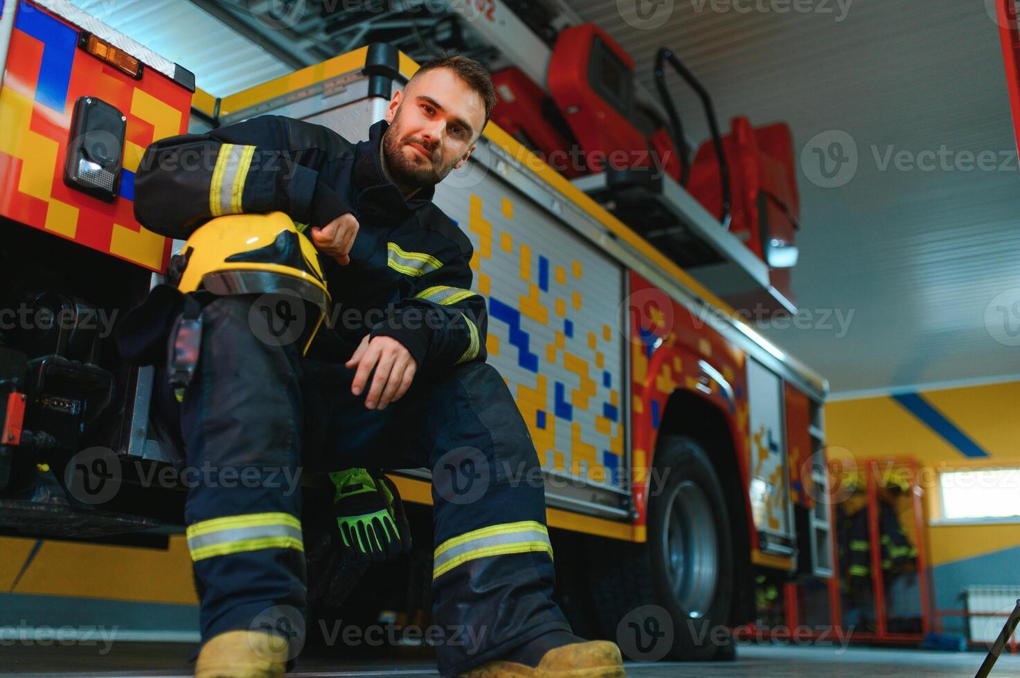 Photo of fireman with gas mask and helmet near fire engine