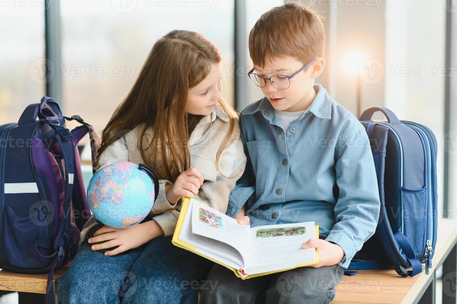 Portrait of two schoolchildren a boy and a girl photo