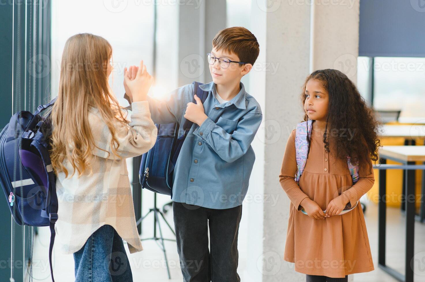 Portrait of kids standing in elementary school hallway photo
