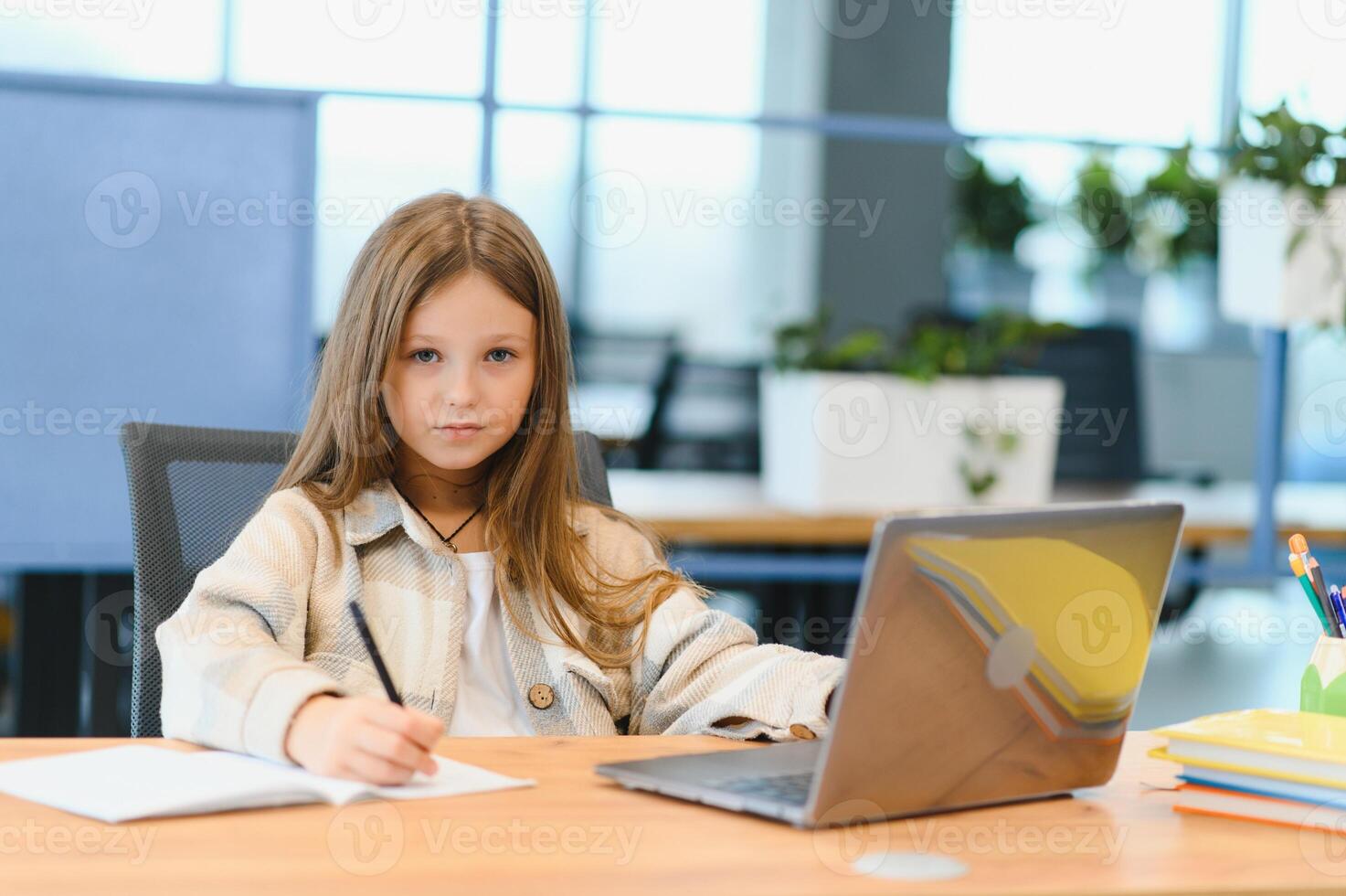 Smiling little Caucasian girl have call distant class with teacher photo