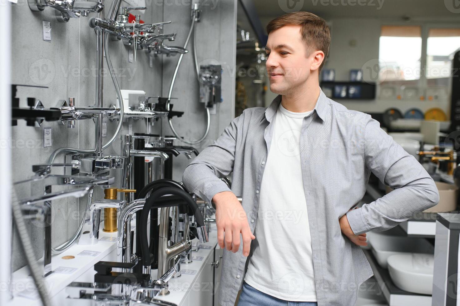 Man chooses a products in a sanitary ware store photo