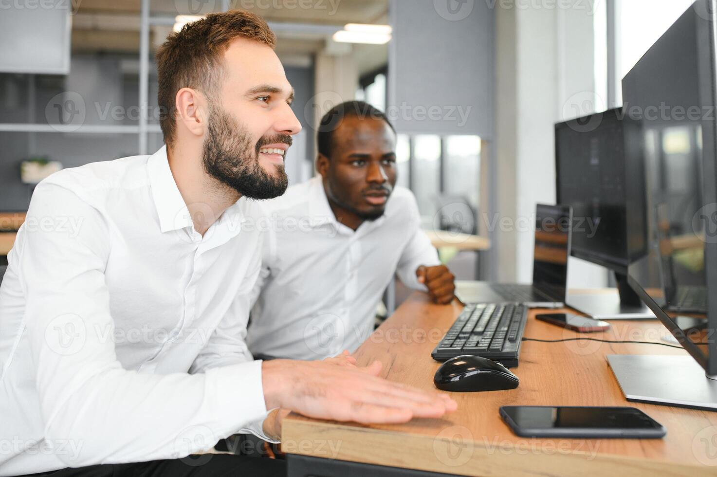 Two diverse crypto traders brokers stock exchange market investors discussing trading charts research reports growth using pc computer looking at screen analyzing invest strategy, financial risks photo