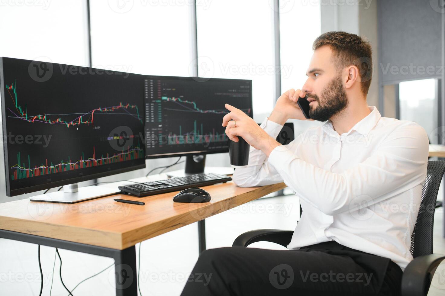 business man looking at the charts of the stock market of cryptocurrencies on the PC screen photo