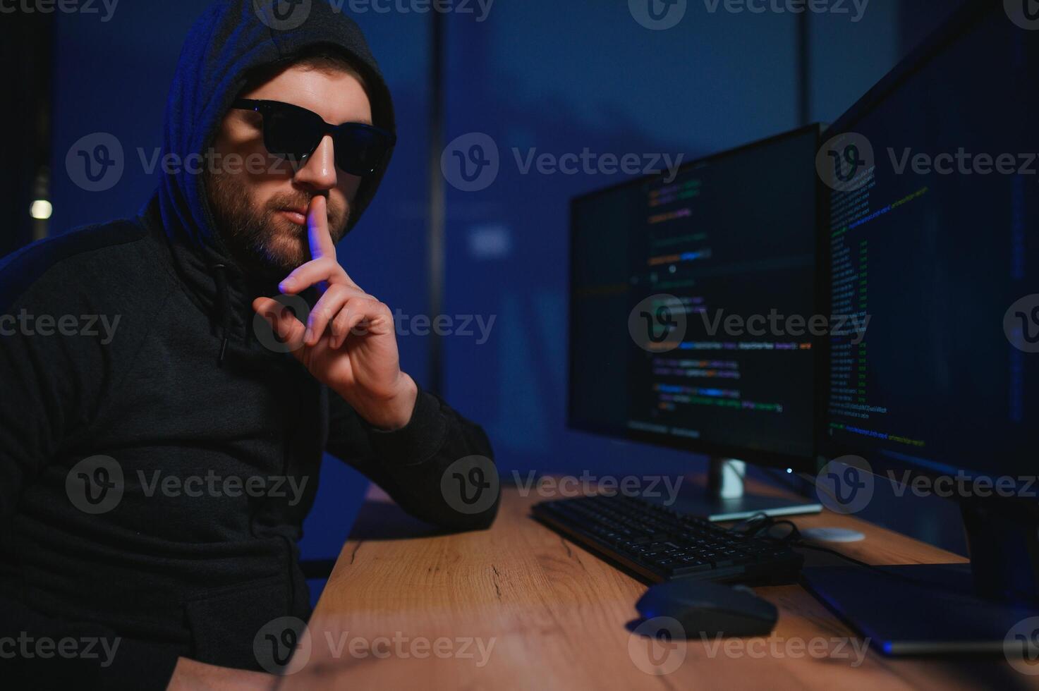 Wanted hackers coding virus ransomware using laptops and computers. Cyber attack, system breaking and malware concept photo