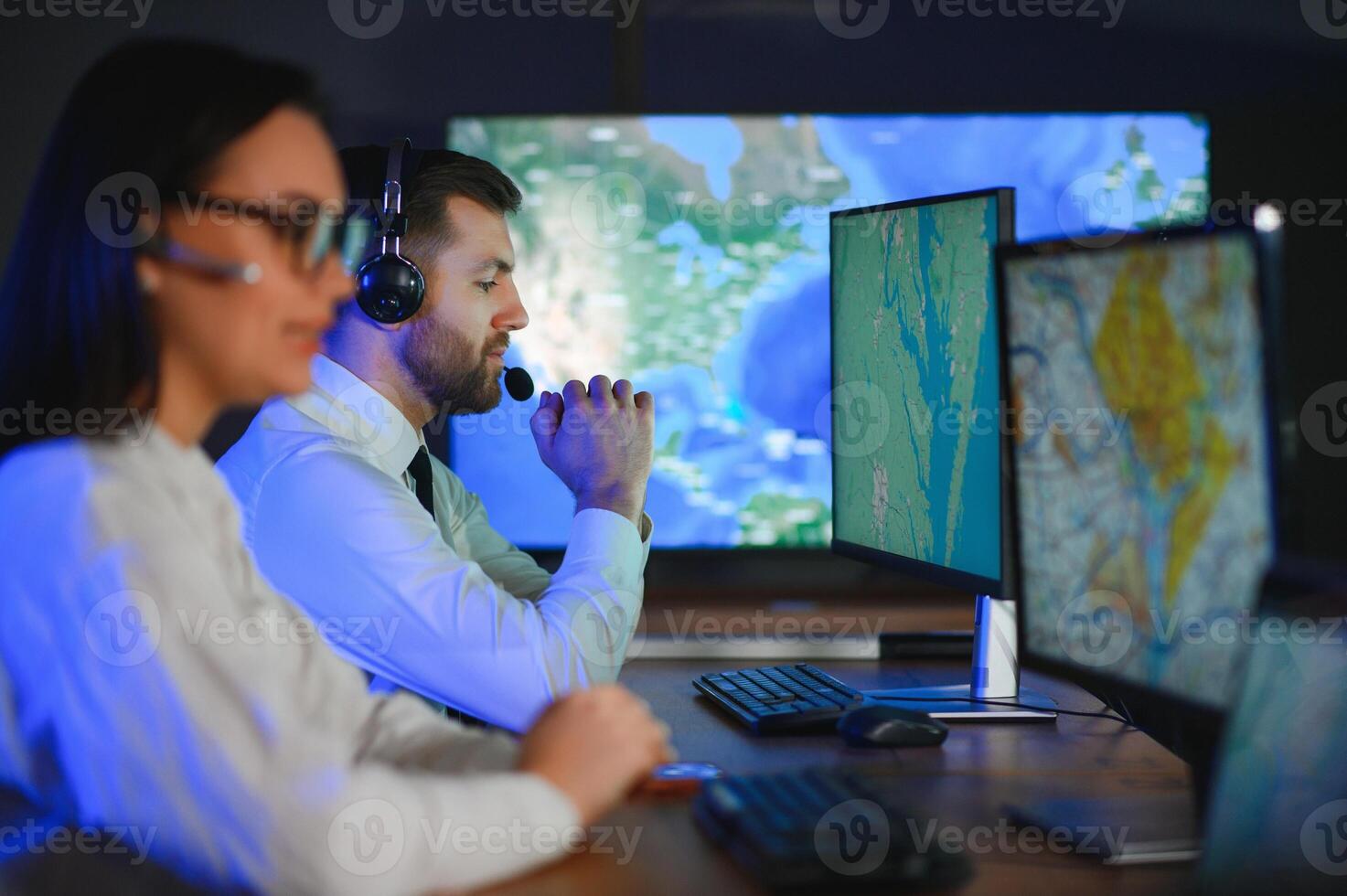 Diverse call center operators team use computers consulting clients in office photo