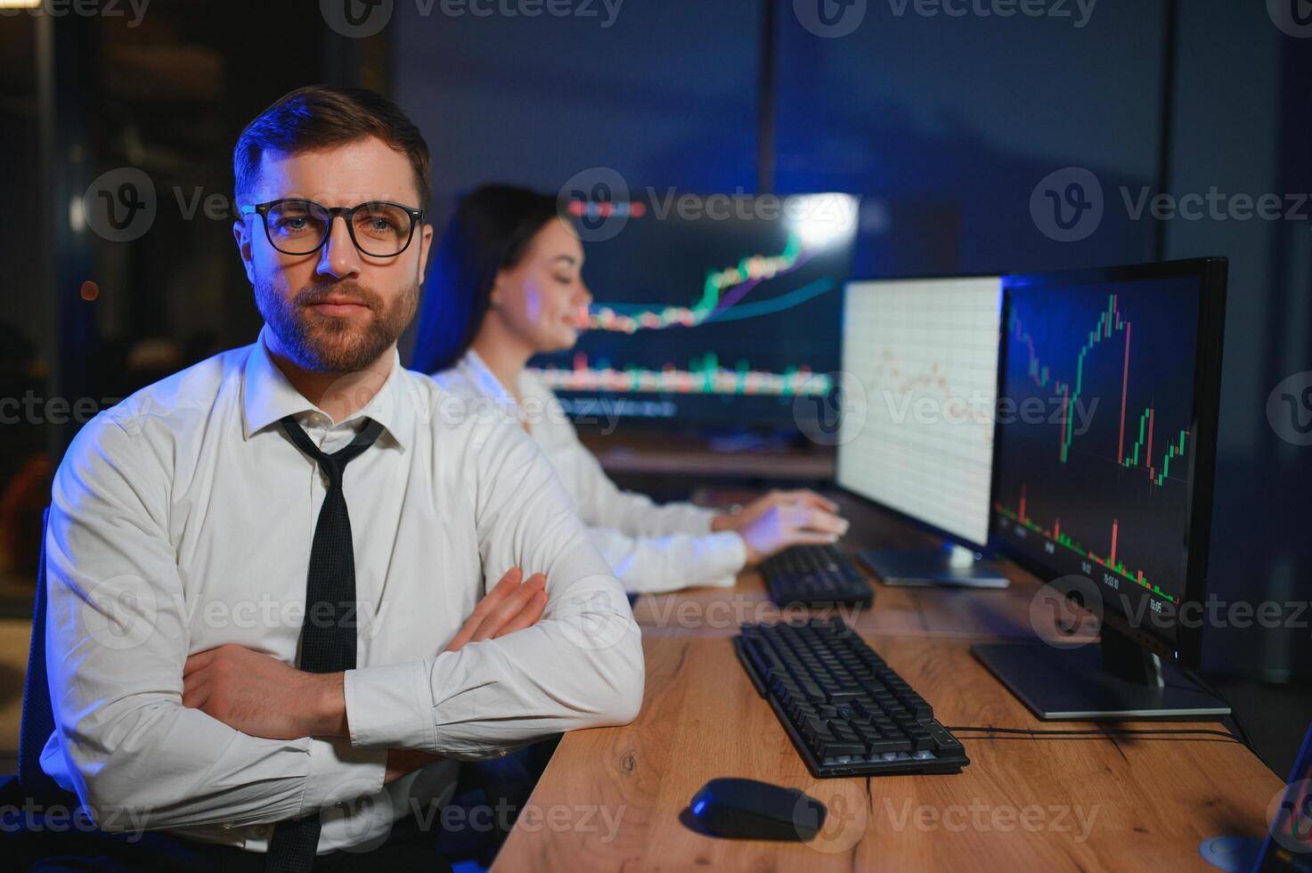 Financial Analyst Talking to Investment Banker in Late Evening at Work photo