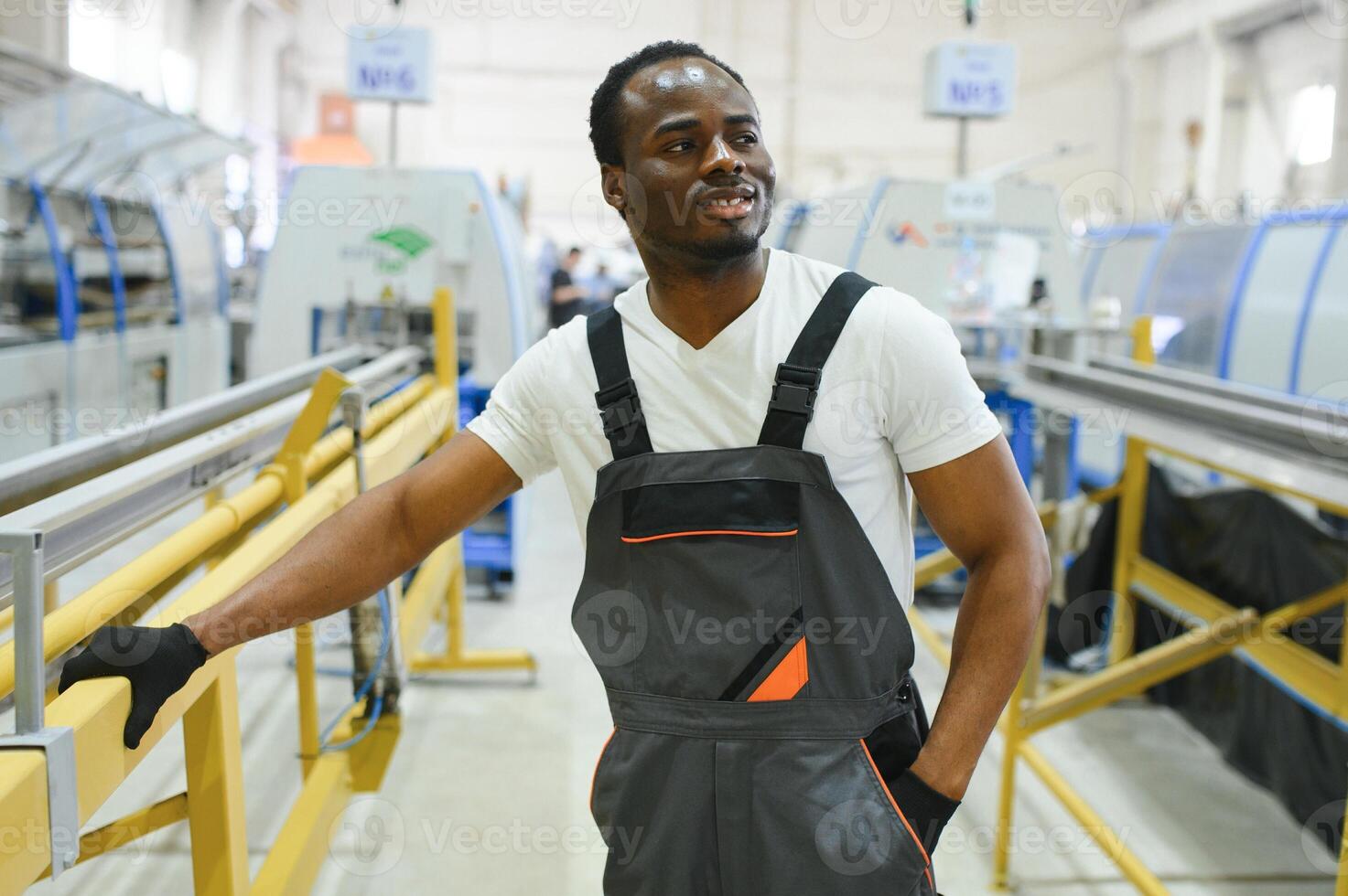 Portrait of industrial engineer. factory worker standing in factory production line photo