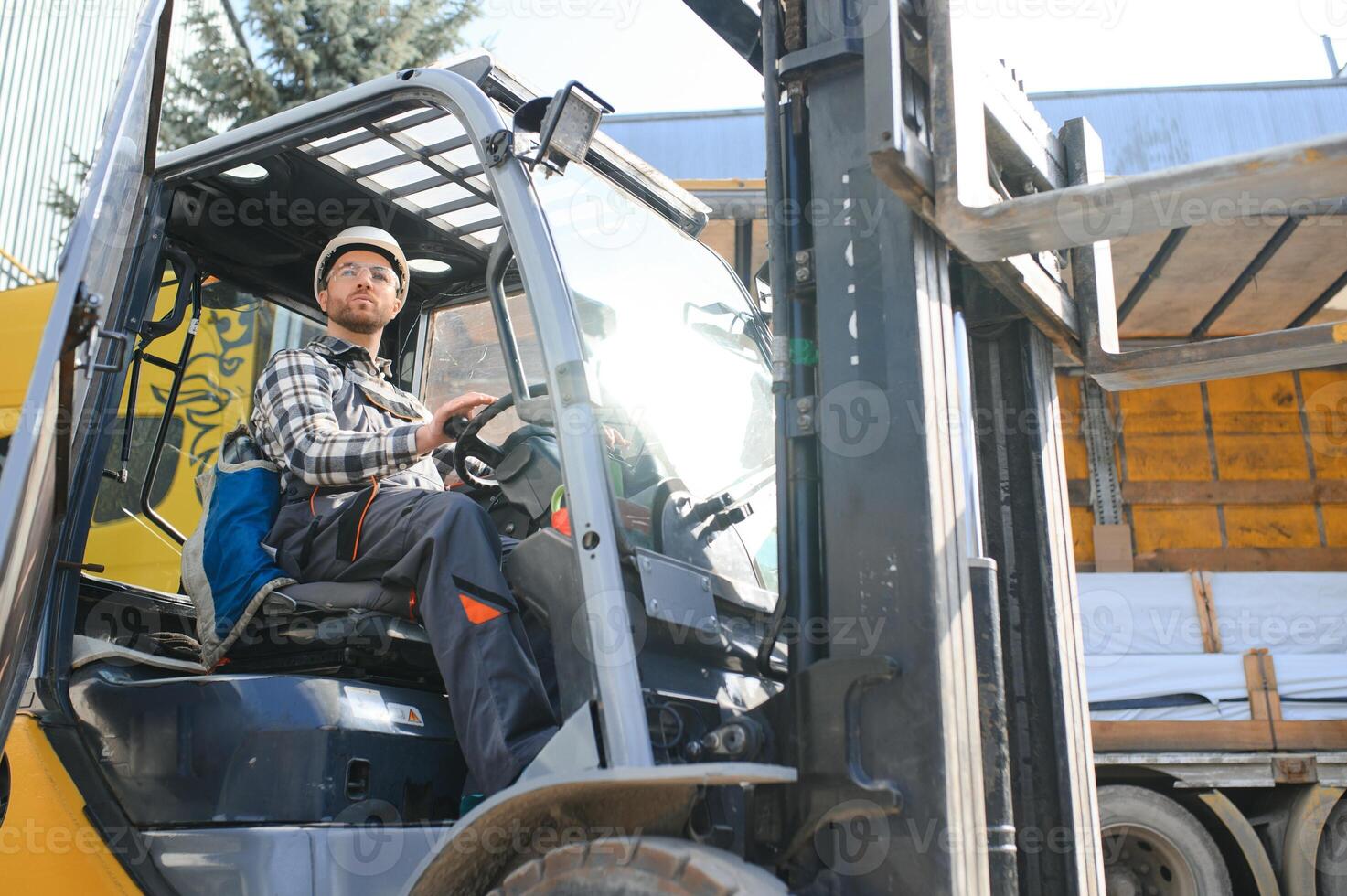 Warehouse man worker with forklift photo