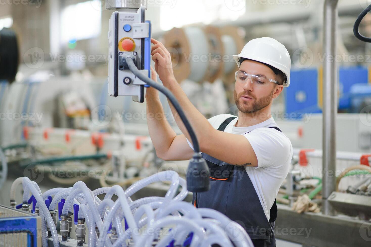 Factory worker. Man working on the production line photo