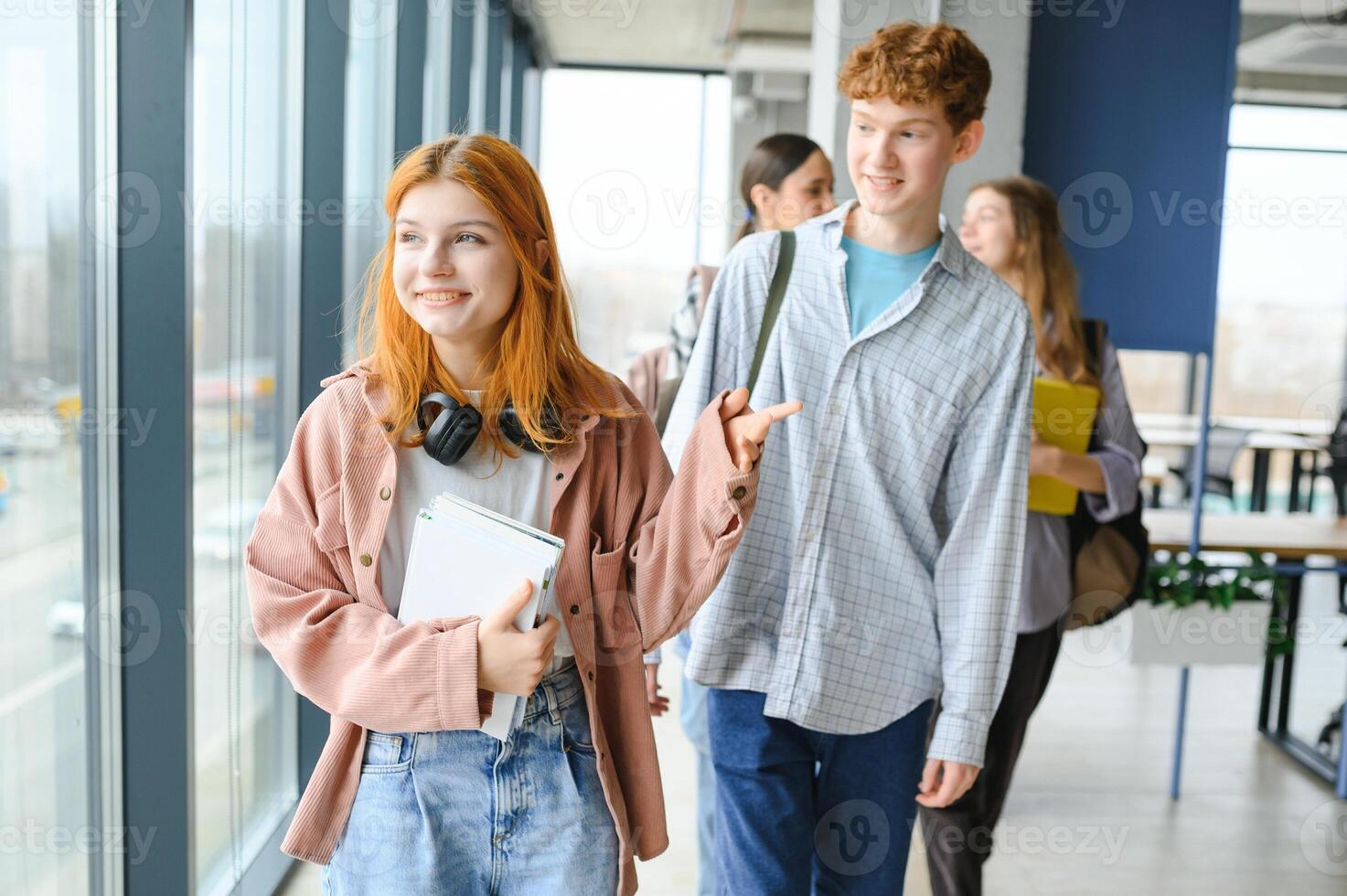 group of college students walking to lecture hall photo