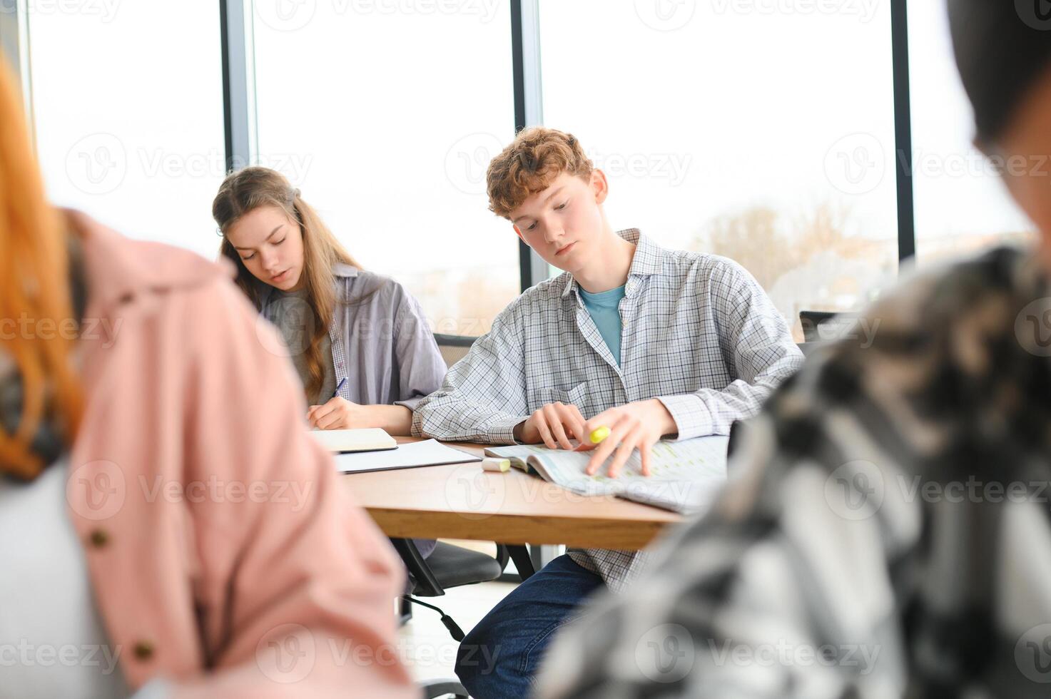Students studying in library or classroom photo