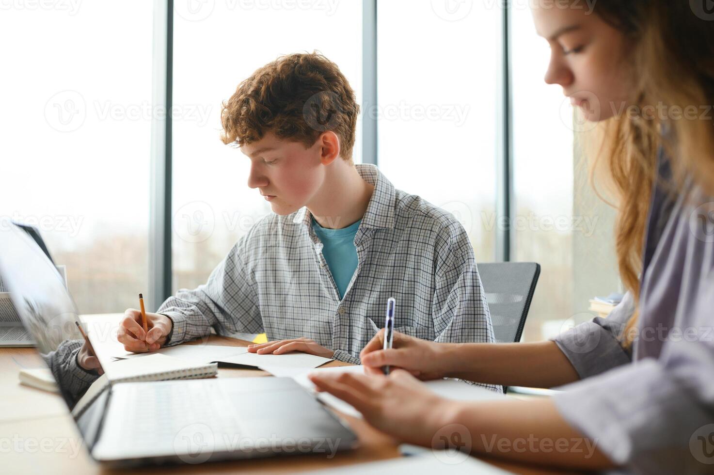Students studying in library or classroom photo