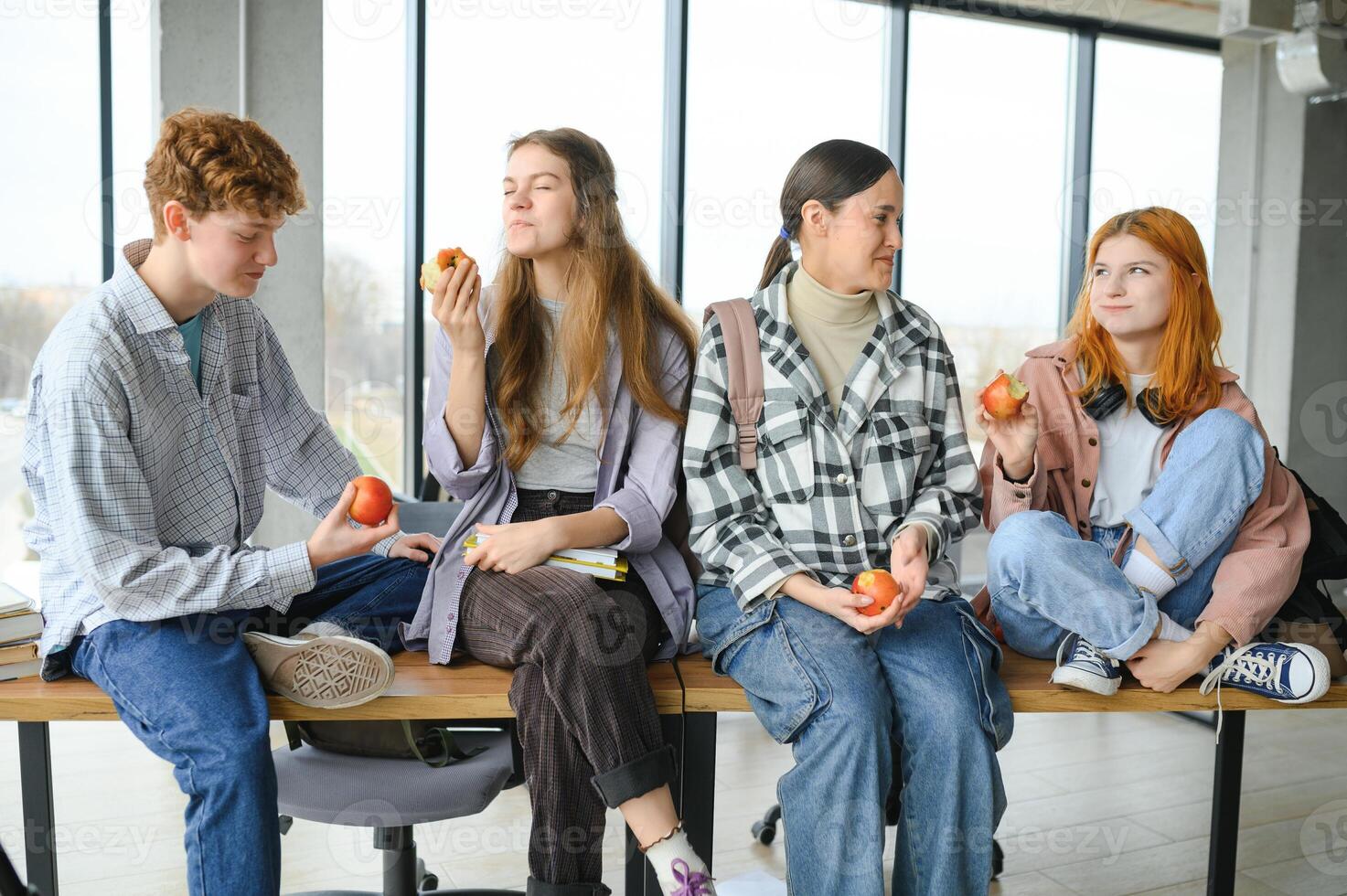 Happy high school students in the classroom photo