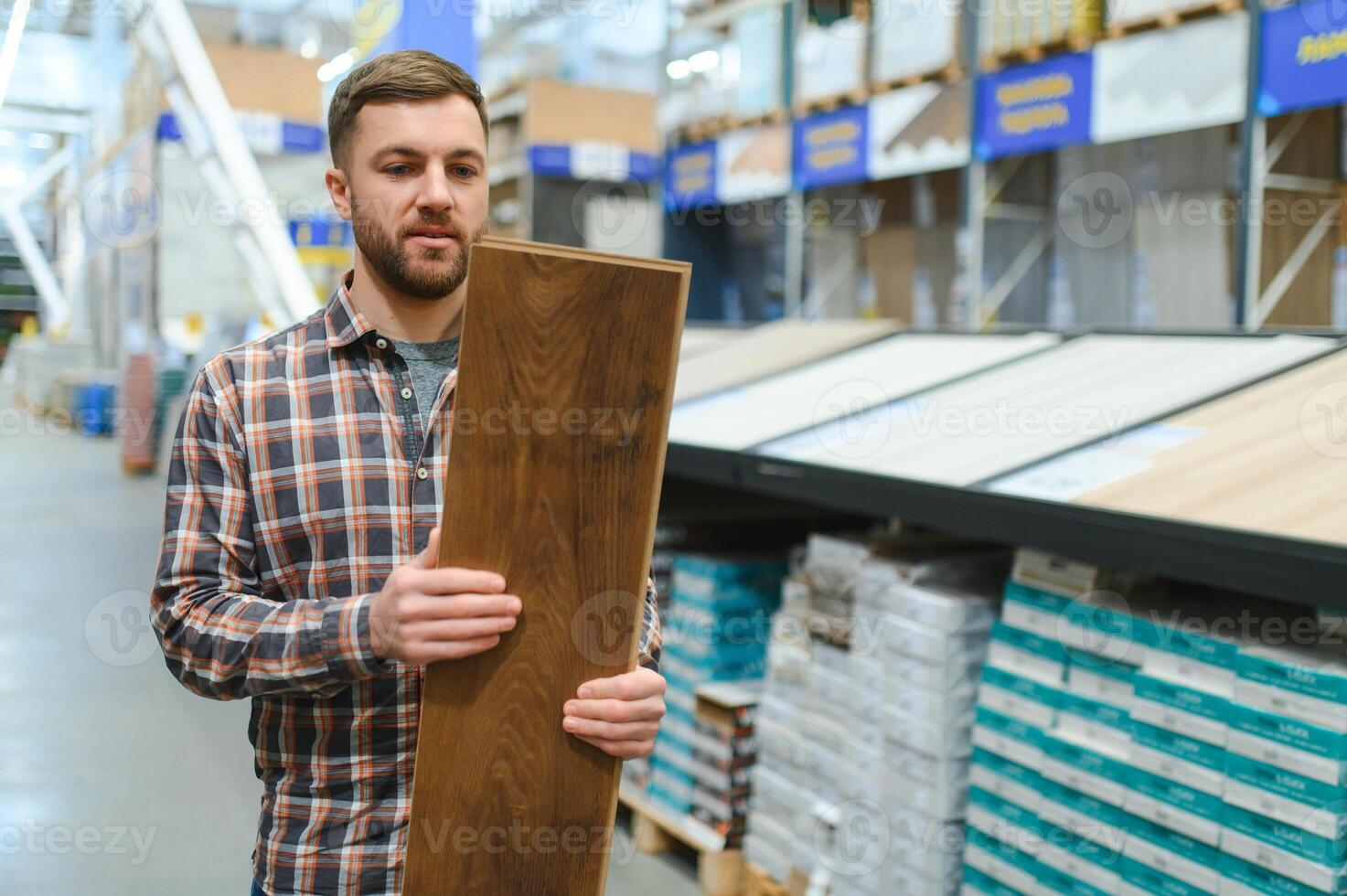 Portrait of happy mature man standing in hardware store photo