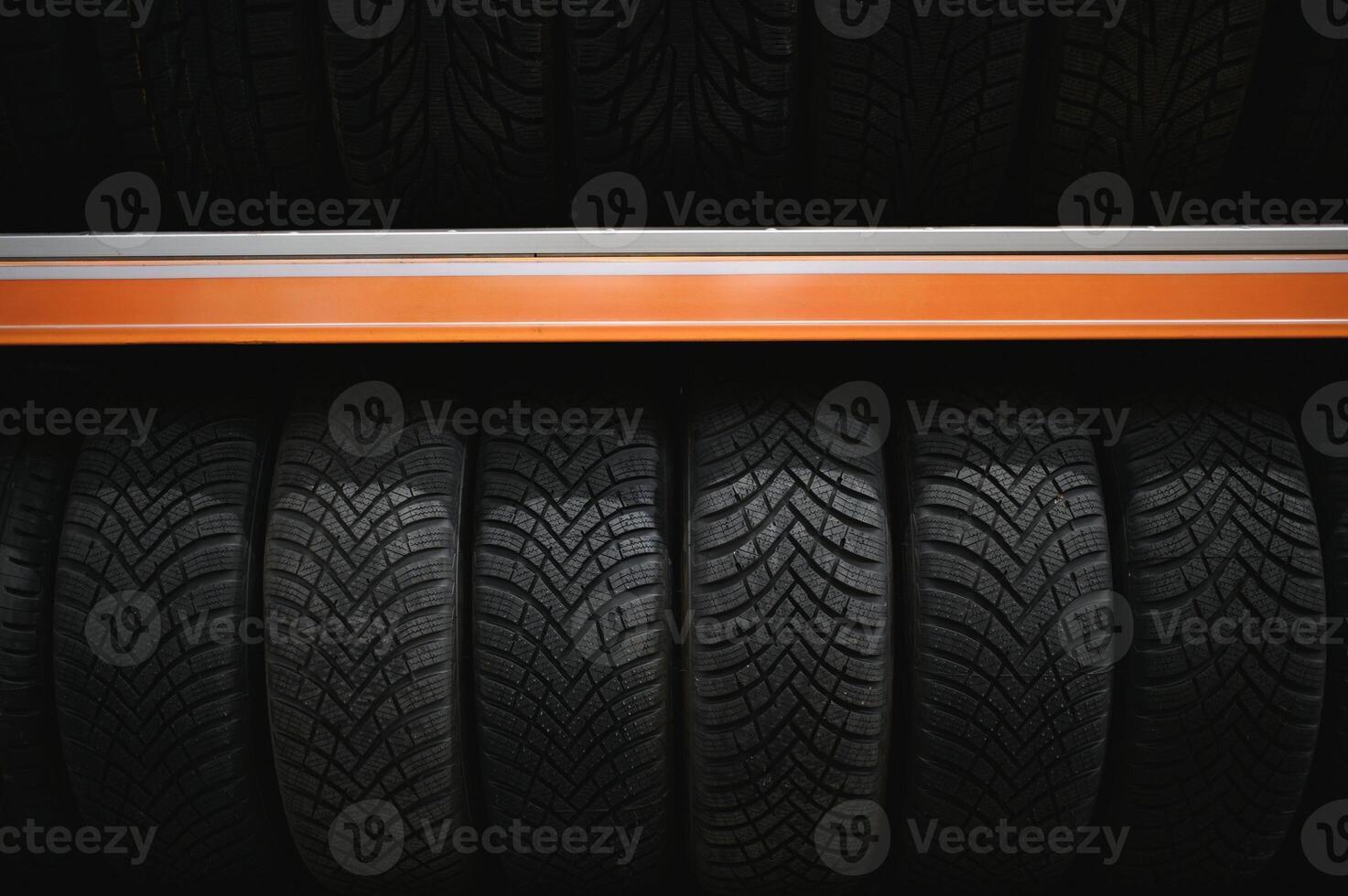 Car tires at warehouse in tire store photo