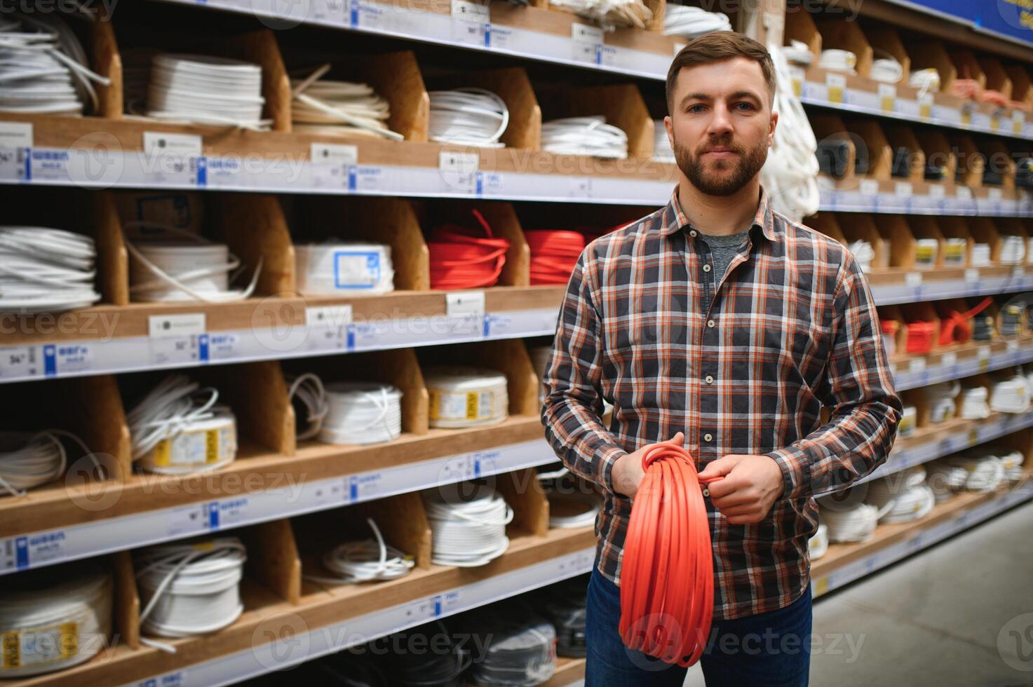 Electrician in the electrical component store. Construction industry, electrical system photo