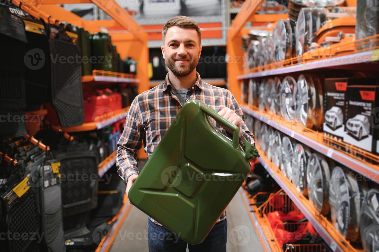 A male customer stands in an auto parts store with a jerry can photo