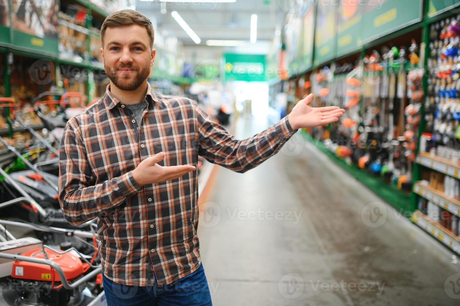 Young man working in hardware store photo