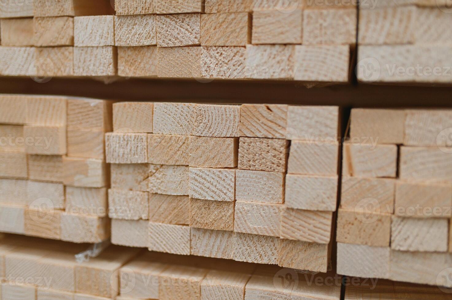 Perspective angle of wooden planks in close-up at a lumber warehouse photo