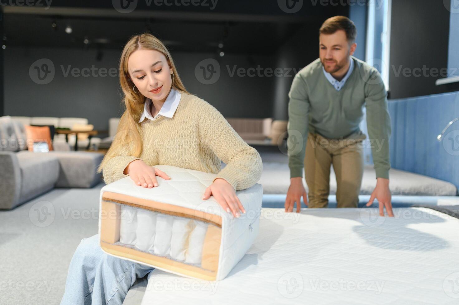 Attractive woman with her husband at the furniture store showroom photo