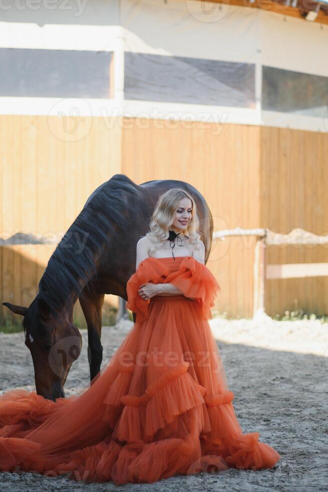 young woman in a dress with a horse photo