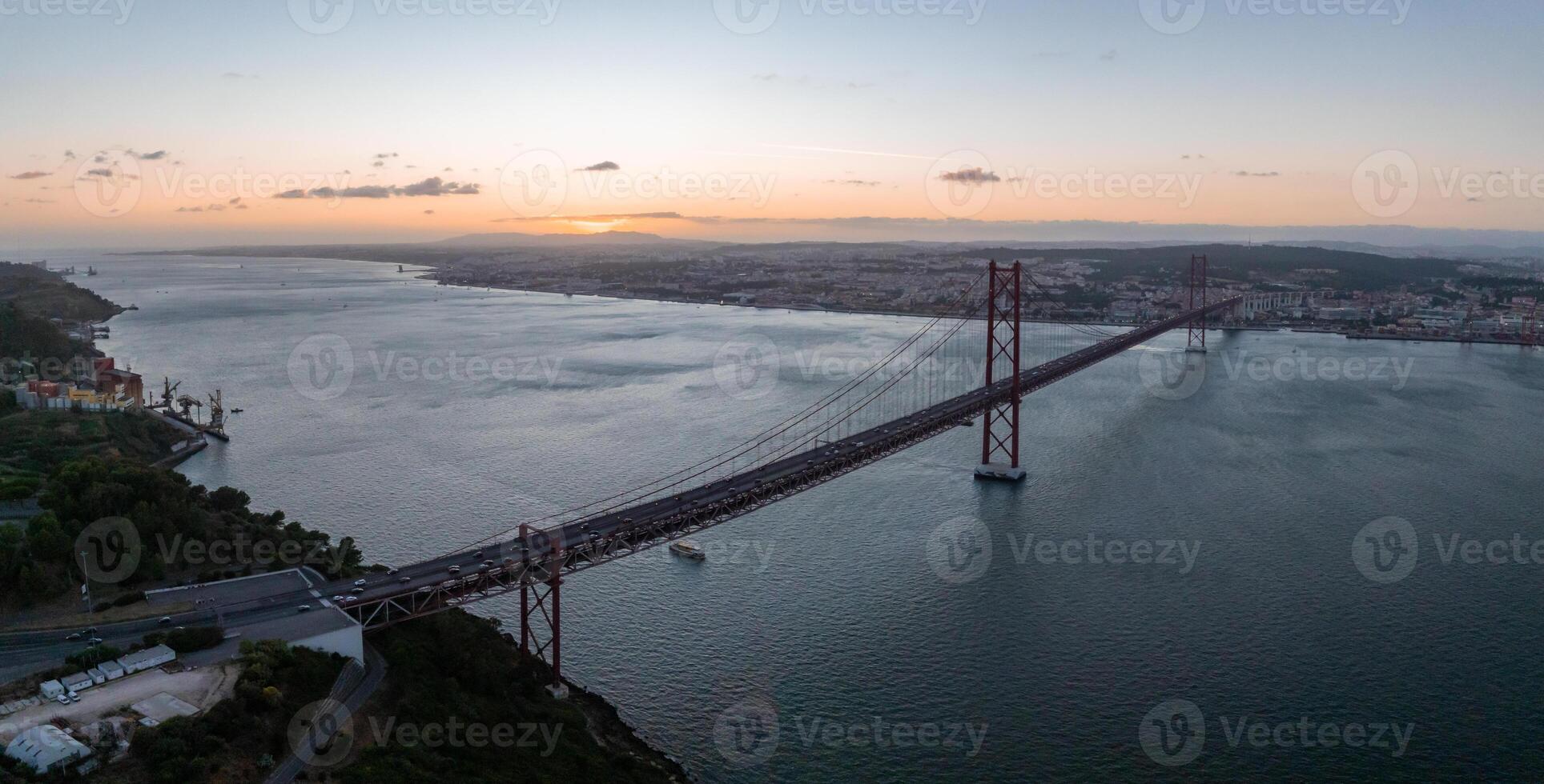 Aerial view of the 25th April Bridge. Ponte 25 de Abril. A suspension bridge road and rail over the Tagus river photo