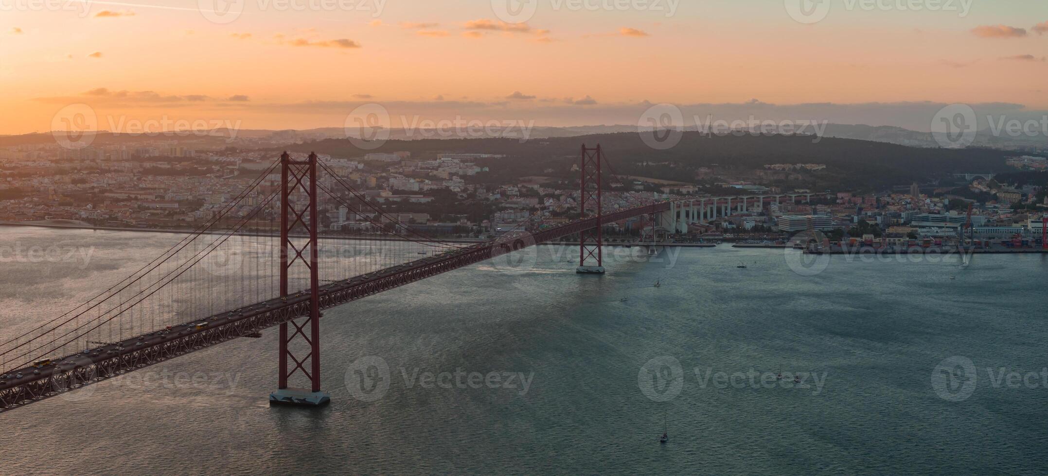 Aerial view of the 25th April Bridge. Ponte 25 de Abril. A suspension bridge road and rail over the Tagus river photo