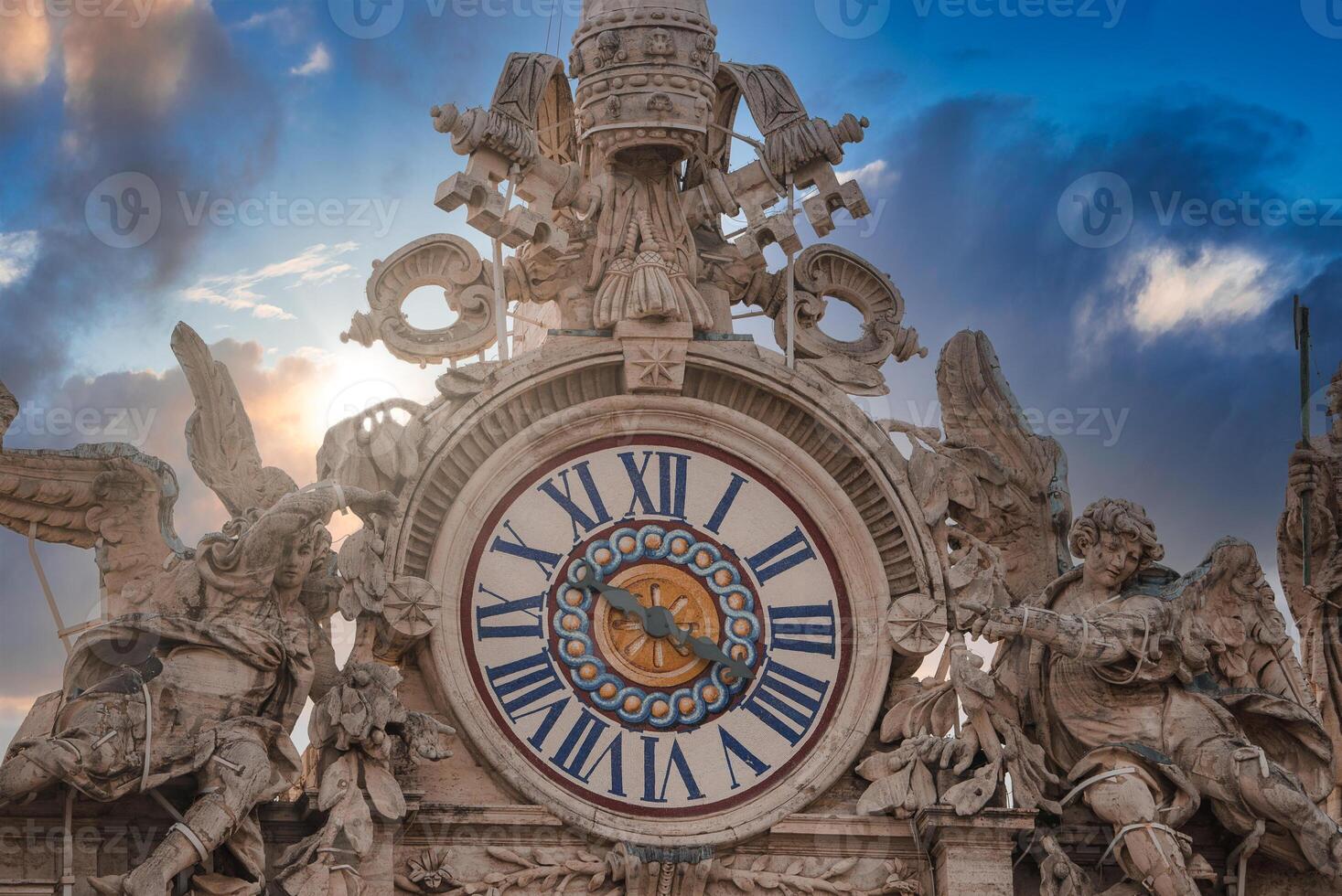 Baroque clock with Roman numerals and cherubs in Vatican City. photo