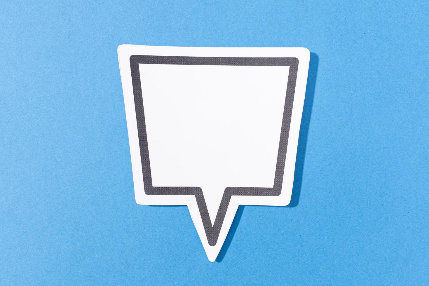 Blank Speech Bubble isolated on blue background. Mock up templateblue background photo
