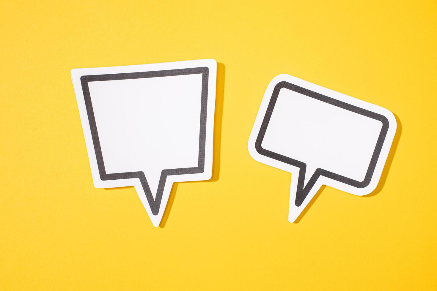 Two Blank Speech Bubble isolated on yellow background. Mock up template photo